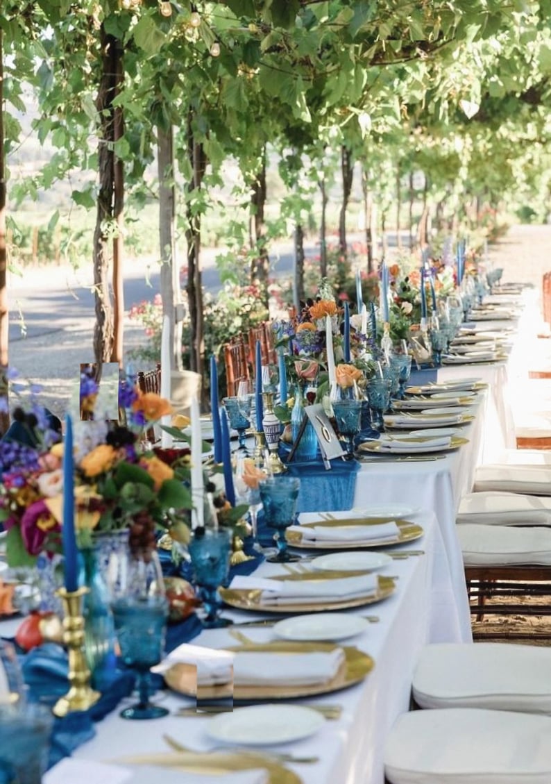 Beachside wedding setup under white umbrellas